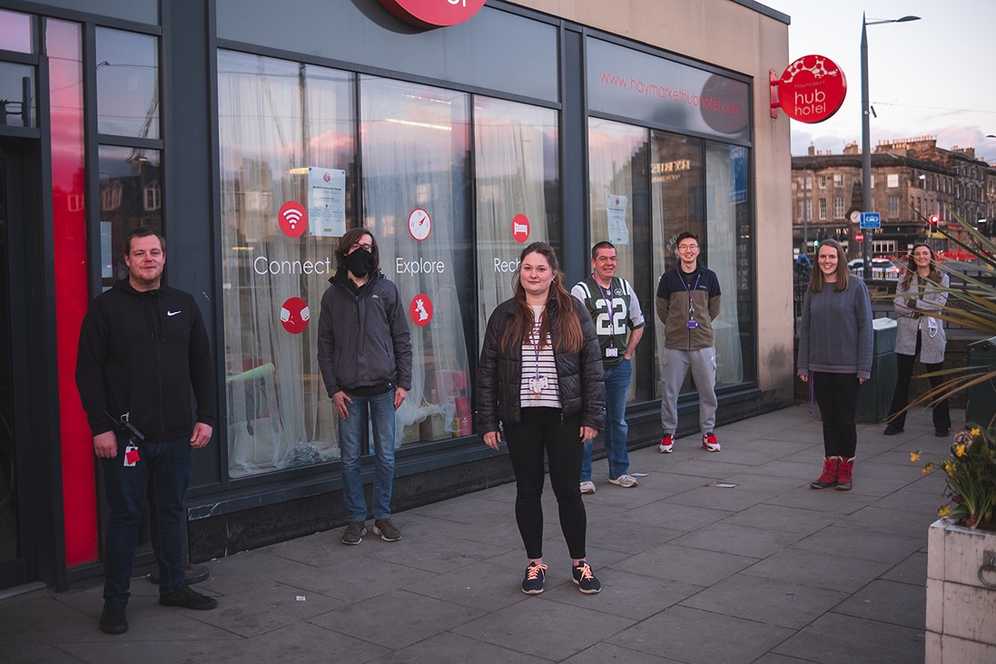 Support team standing outside Haymarket Hub Hotel, in Edinburgh city centre, the host for the Welcome Centre.