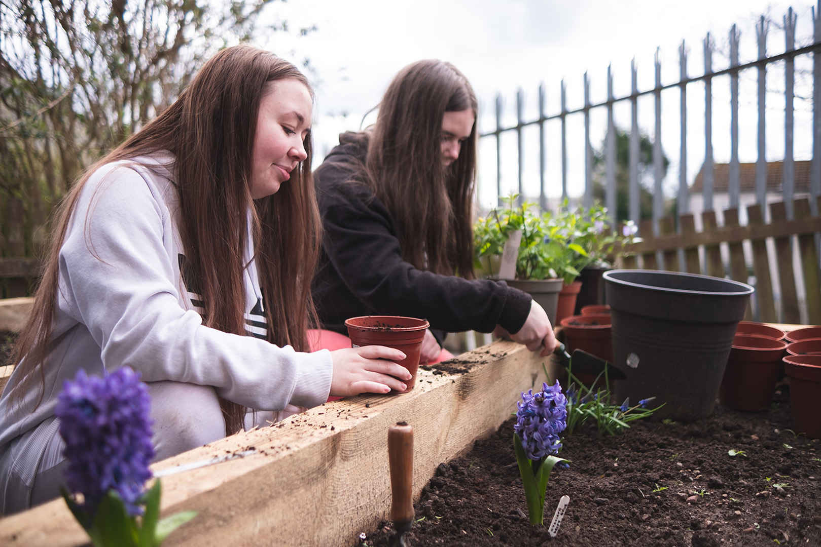 Young residents of Kharis Court working in the garden